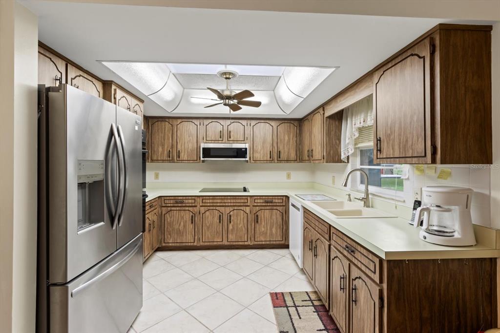 3550 South Dean Terrace Inverness, FL 34452 - Photo 18 of 37 a kitchen with stainless steel appliances granite countertop a sink stove and refrigerator