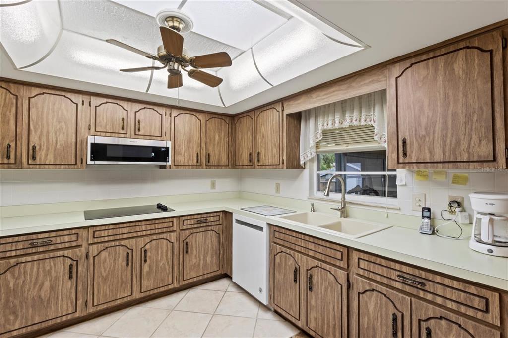 3550 South Dean Terrace Inverness, FL 34452 - Photo 20 of 37 a kitchen with cabinets appliances a sink and a counter top space