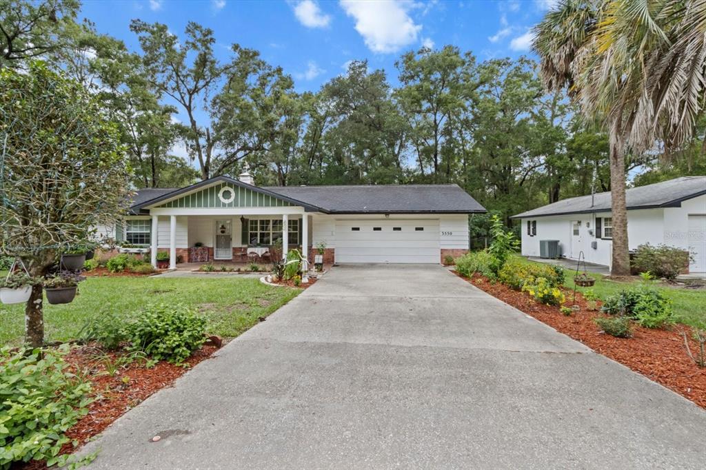 3550 South Dean Terrace Inverness, FL 34452 - Photo 2 of 37 a front view of a house with a yard and garage