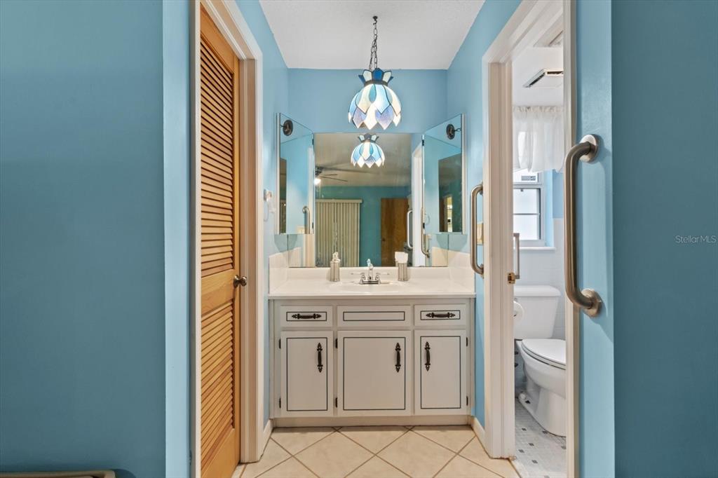 3550 South Dean Terrace Inverness, FL 34452 - Photo 23 of 37 a bathroom with a granite countertop sink a toilet and a mirror