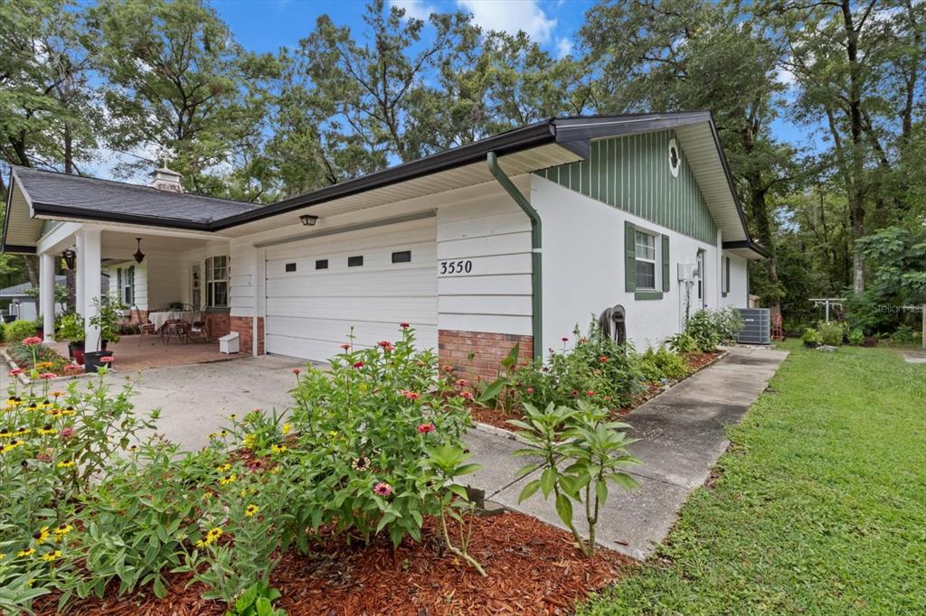3550 South Dean Terrace Inverness, FL 34452 - Photo 3 of 37 a white house that has a tree in front of it