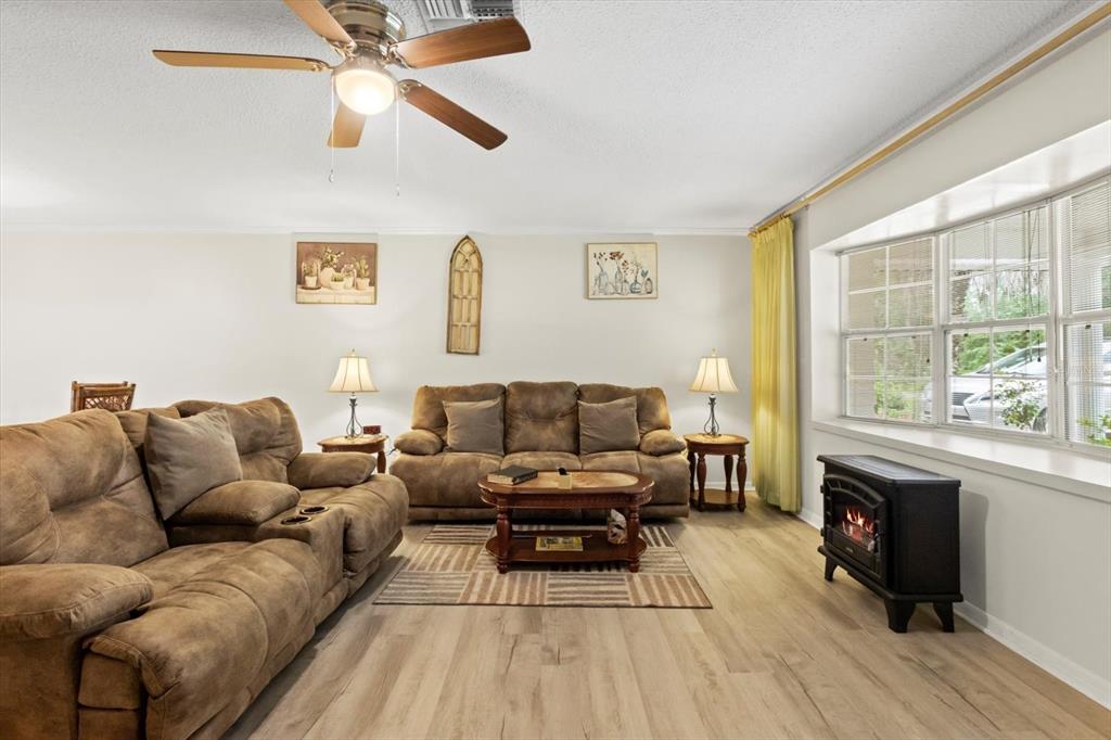 3550 South Dean Terrace Inverness, FL 34452 - Photo 8 of 37 a living room with furniture and a fireplace