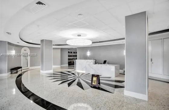 a front view of a building with outdoor space