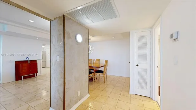 a view of a hallway with seating area