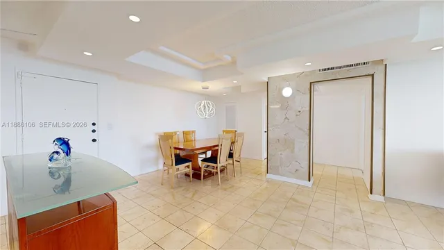 a kitchen with granite countertop a refrigerator stove and microwave
