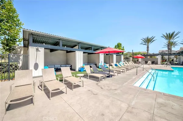 a view of a backyard with swimming pool