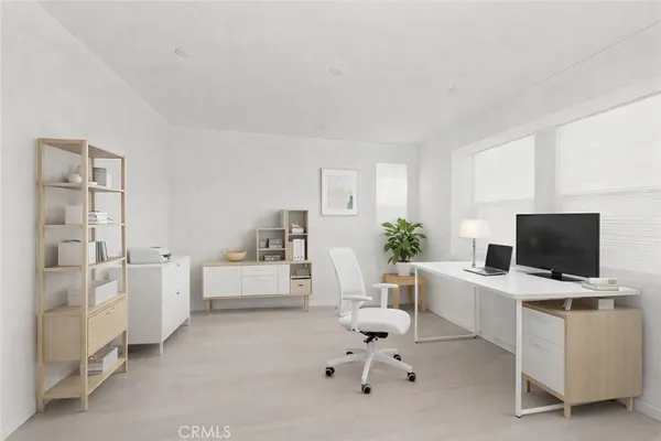 a workspace with furniture and white walls