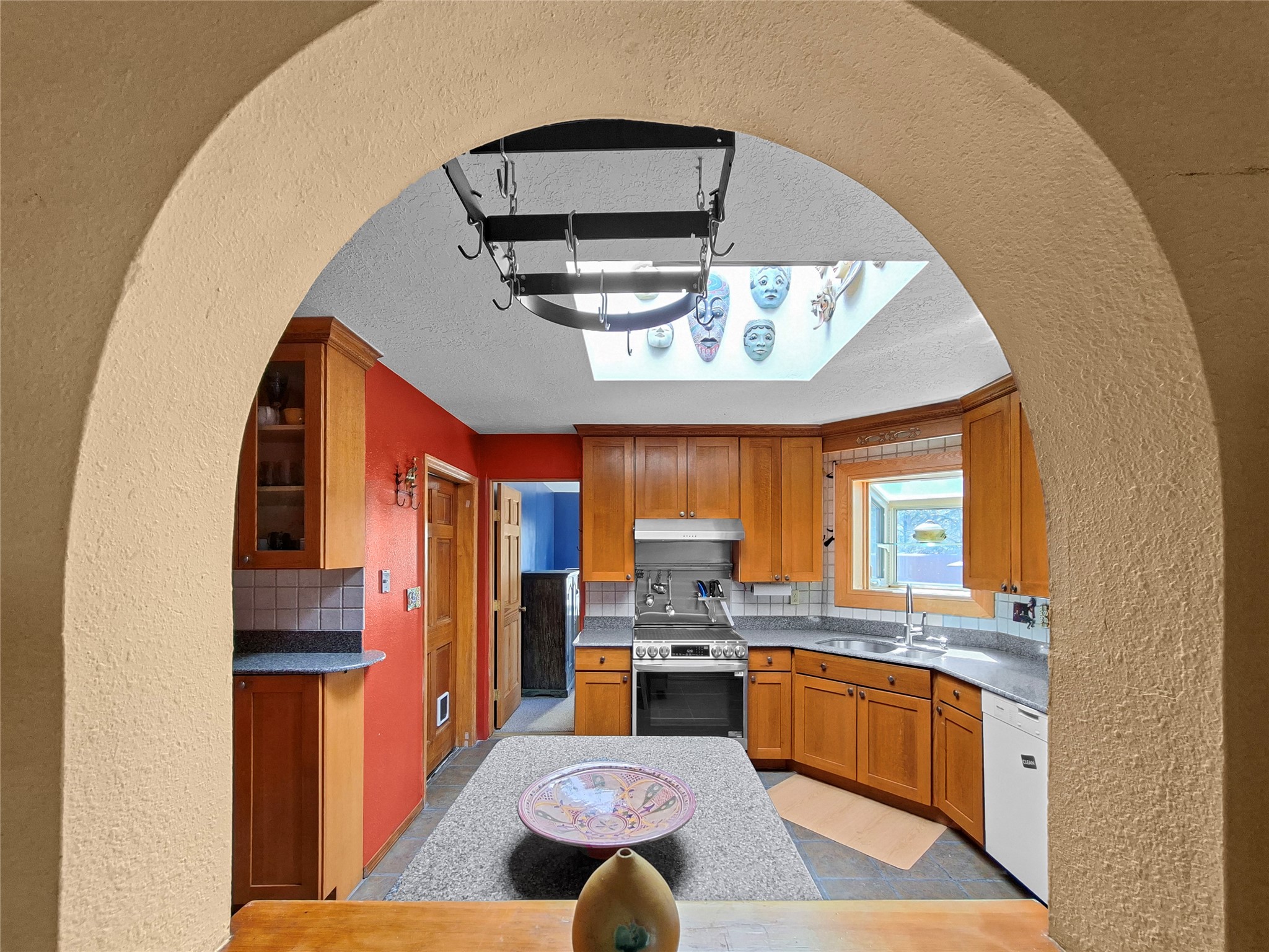 57 Verano Loop Santa Fe, NM 87508 - Photo 13 of 43 Archway window looking into the kitchen
