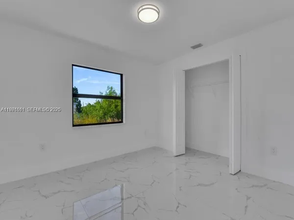 an empty room with window