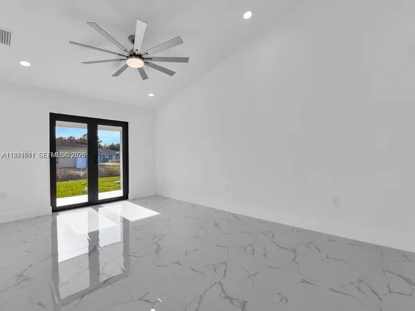 a view of an empty room with a window