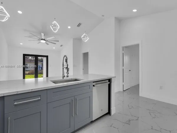 a kitchen with a sink and cabinets