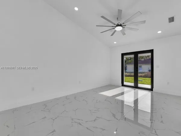 a view of an empty room with a window