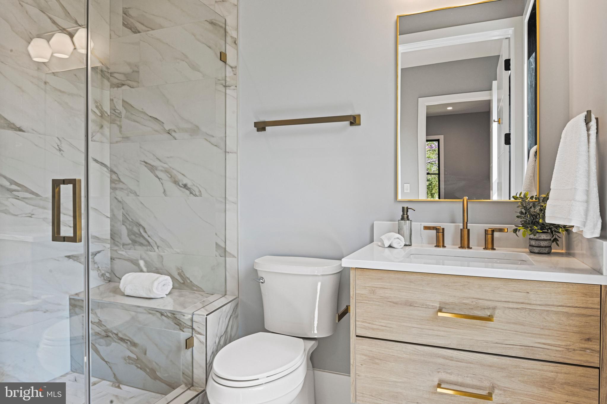 1052 Balls Hill Road McLean, VA 22101 - Photo 27 of 64 a bathroom with a sink a toilet and shower