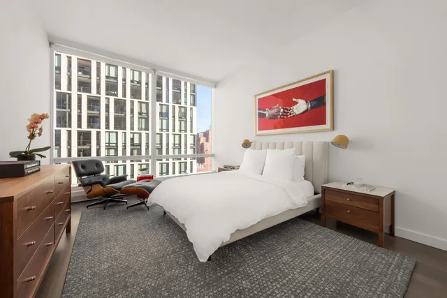 a bedroom with bed and a window