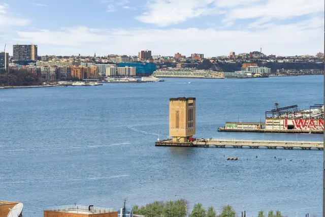 a view of a lake with tall buildings