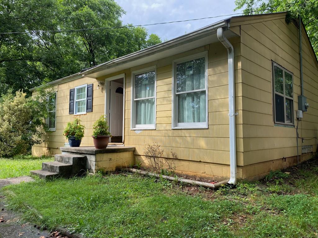 204 Kay Road Southwest Marietta, GA 30008 - Photo 1 of 1 a view of a house with a yard