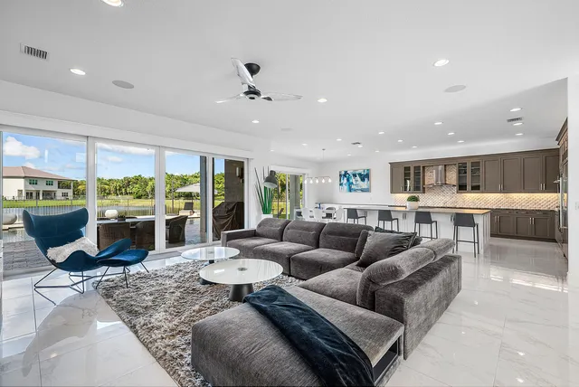 a large kitchen with a table and chairs