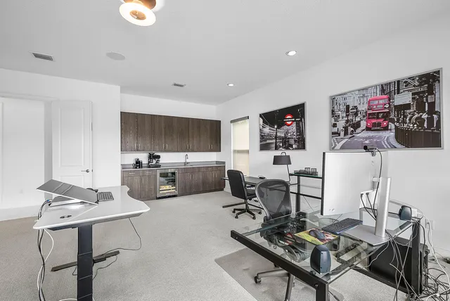a bathroom with a granite countertop sink a toilet and shower