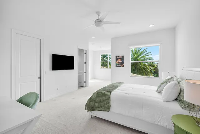 a balcony with furniture and a floor to ceiling window