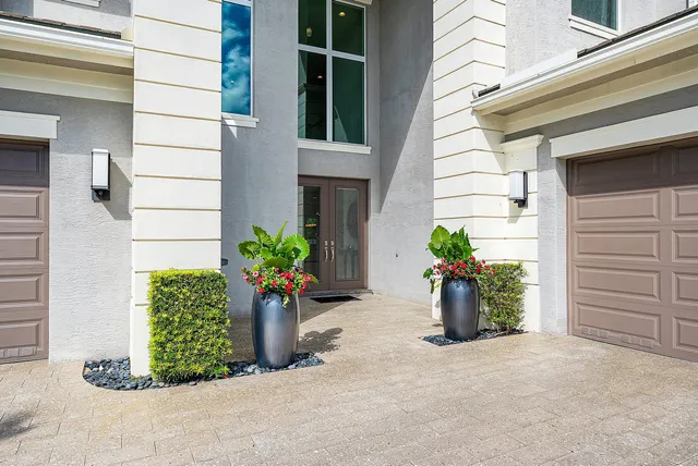 a view of a livingroom with furniture and a potted plant