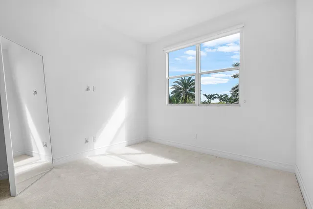 a view of a lake with houses in the back
