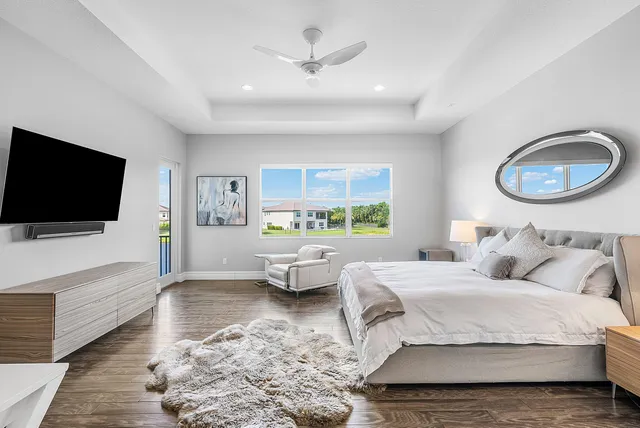 a view of swimming pool with outdoor seating and city view