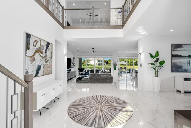 a view of a livingroom with furniture and staircase