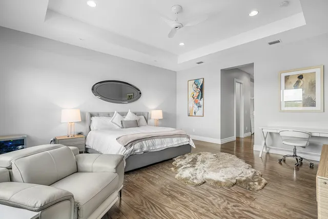 a view of a patio with a table and chairs under an umbrella