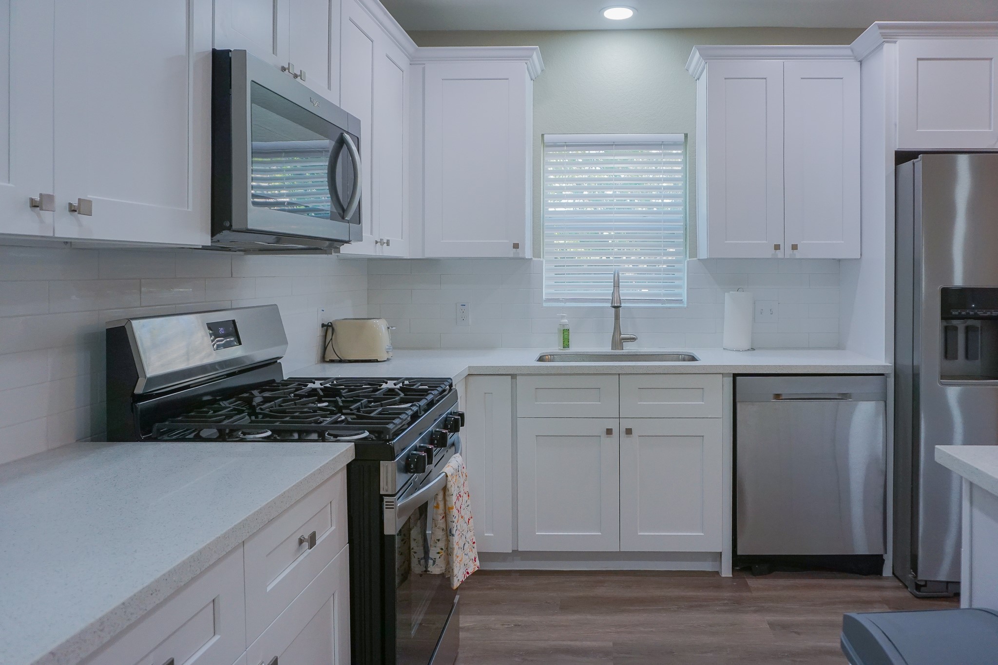 3703 Market Street, Unit 1 Houston, TX 77020 - Photo 6 of 23 The stylish kitchen comes equipped with a refrigerator, as well as essential pots, pans, and utensils.