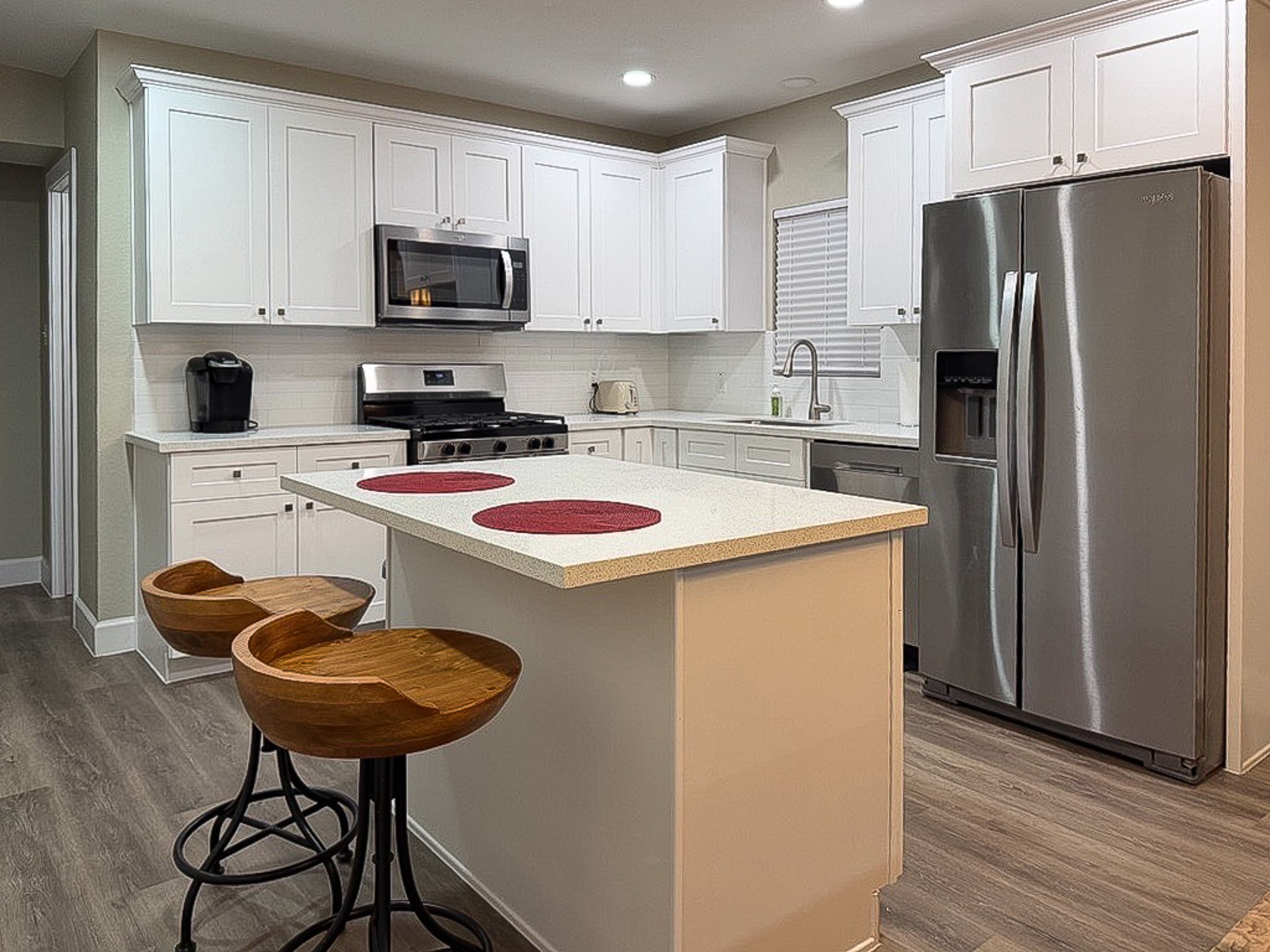 3703 Market Street, Unit 1 Houston, TX 77020 - Photo 10 of 23 Kitchen island featuring bar stools.