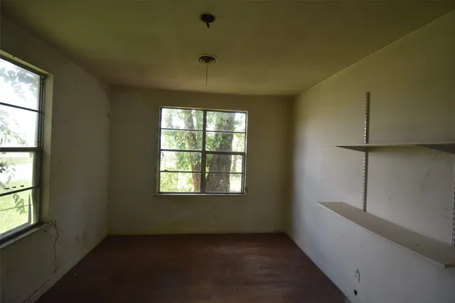 an empty room with windows