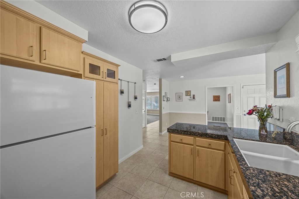 1763 Gleason Street Corona, CA 92882 - Photo 17 of 41 a kitchen with stainless steel appliances granite countertop a refrigerator and a stove