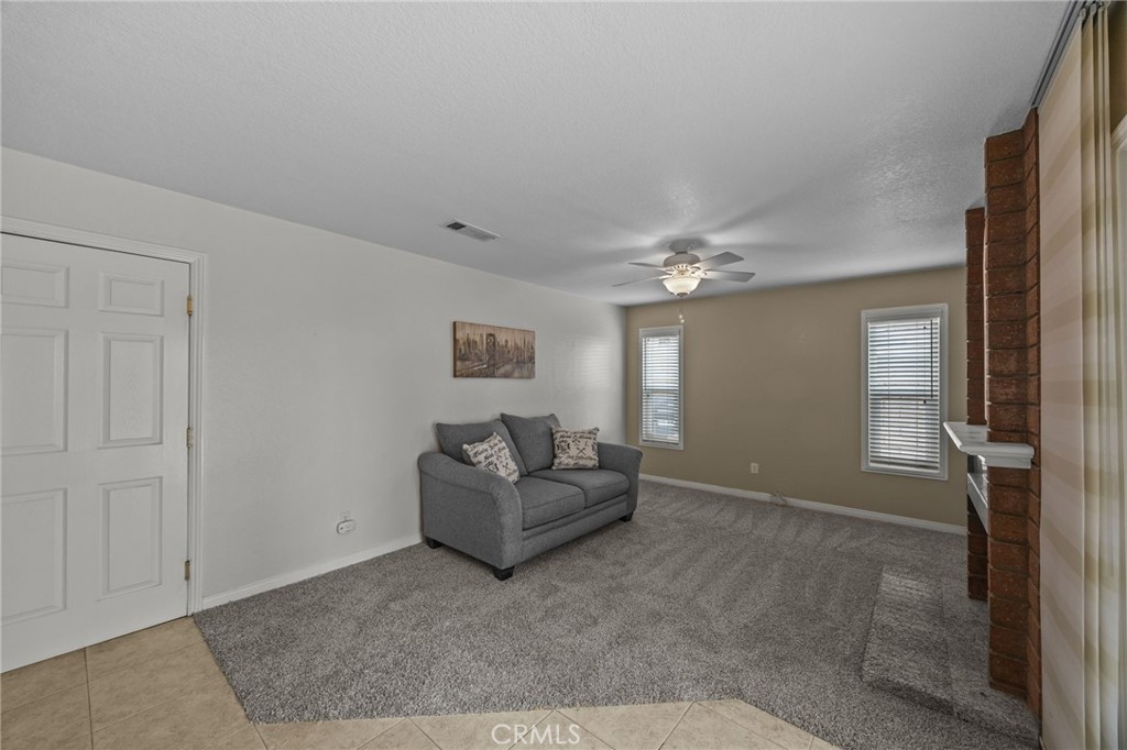 1763 Gleason Street Corona, CA 92882 - Photo 19 of 41 a living room with furniture and a chandelier