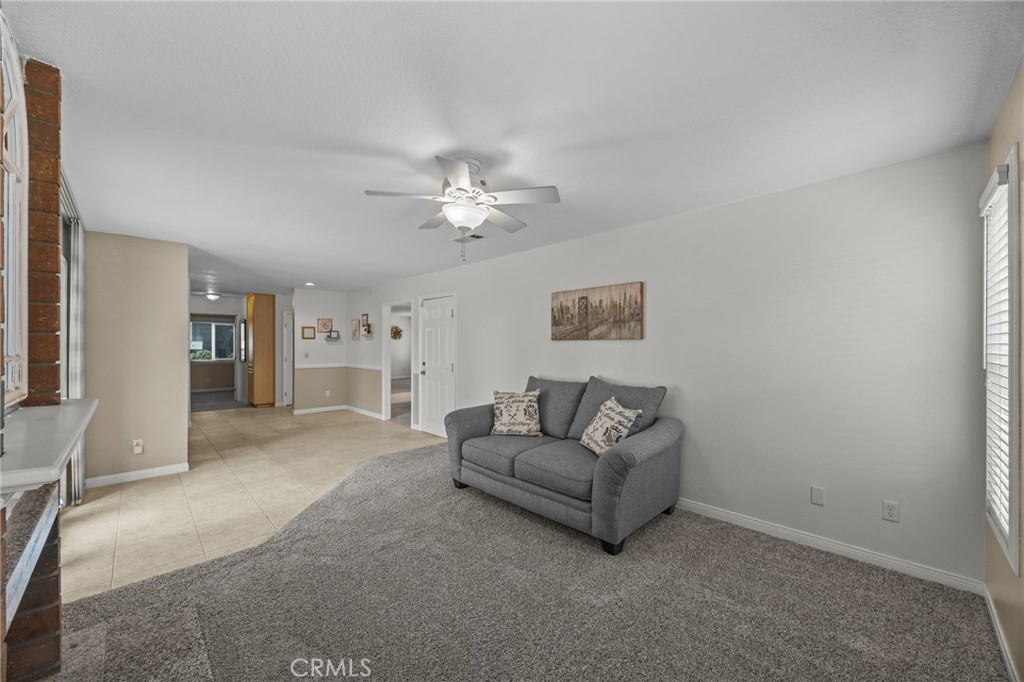 1763 Gleason Street Corona, CA 92882 - Photo 20 of 41 a living room with furniture and a chandelier