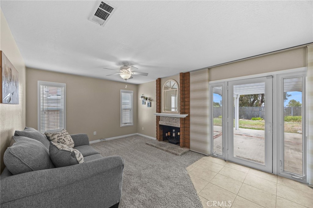 1763 Gleason Street Corona, CA 92882 - Photo 21 of 41 a living room with furniture and a fireplace