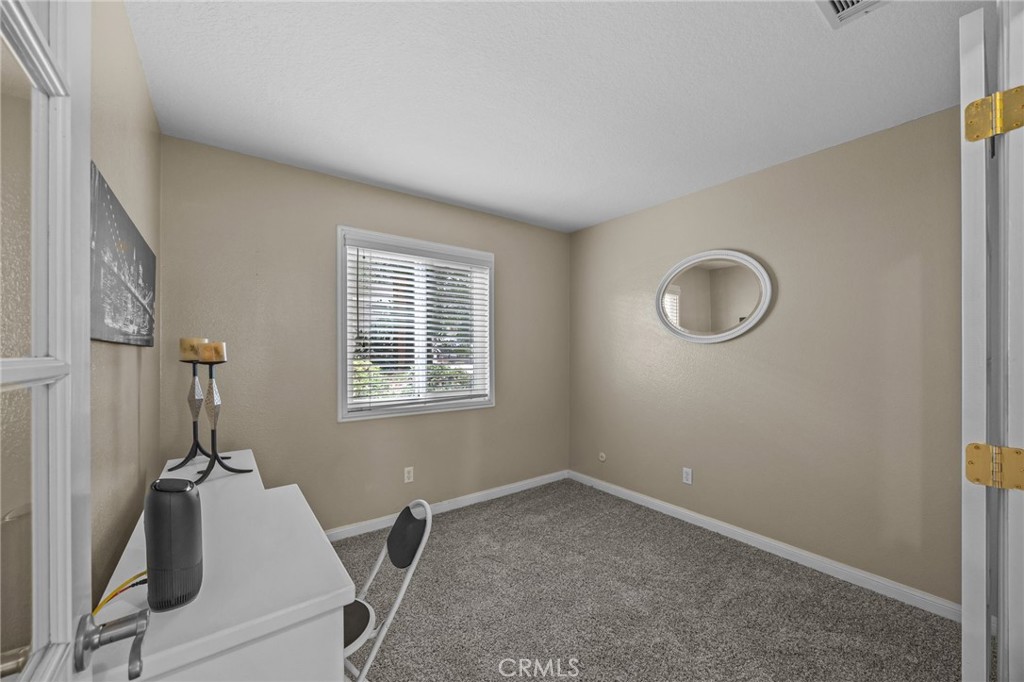 1763 Gleason Street Corona, CA 92882 - Photo 22 of 41 a room with a bed and a window