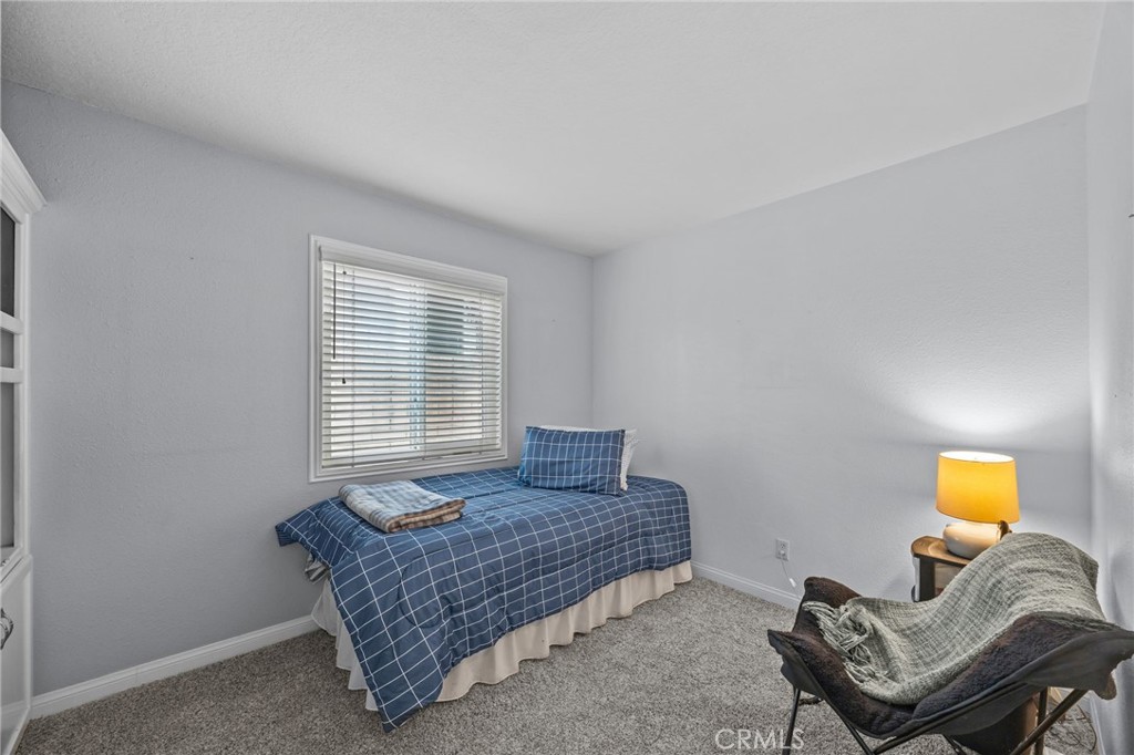 1763 Gleason Street Corona, CA 92882 - Photo 25 of 41 a room with a bed and chair