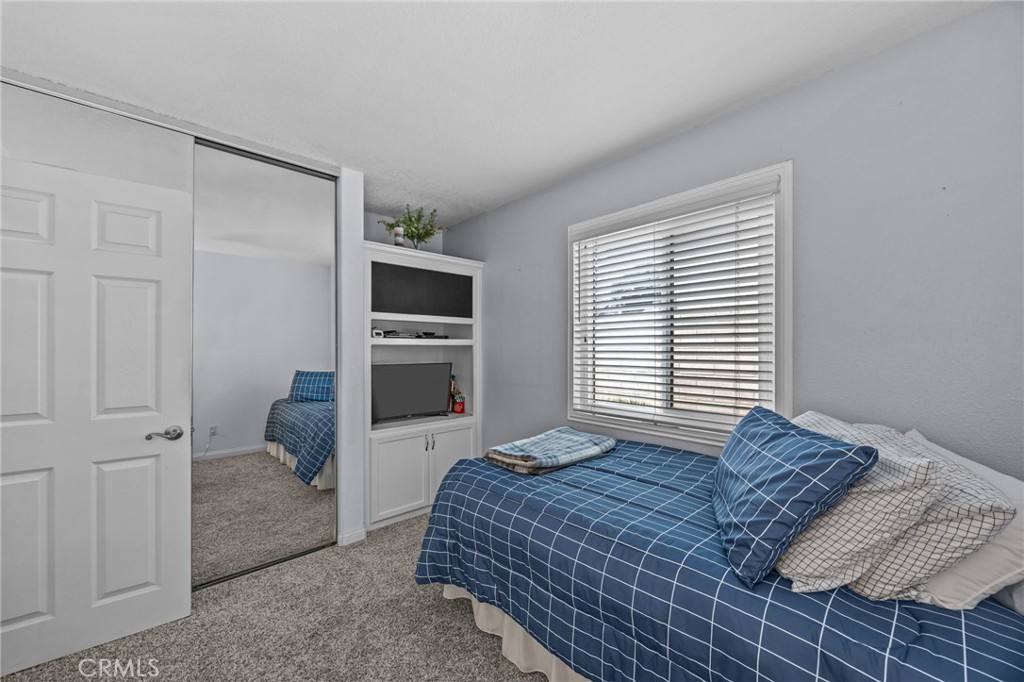 1763 Gleason Street Corona, CA 92882 - Photo 26 of 41 a bedroom with a bed and a television