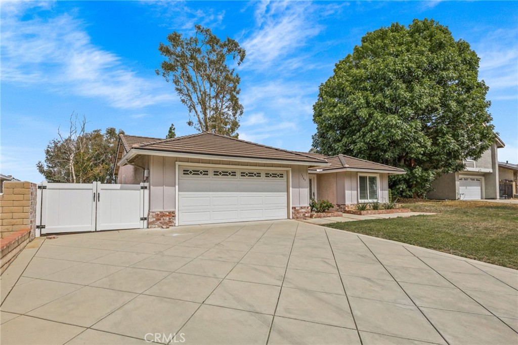 1763 Gleason Street Corona, CA 92882 - Photo 4 of 41 a view of a house with a yard and garage