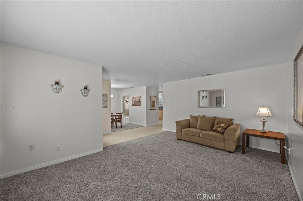 1763 Gleason Street Corona, CA 92882 - Photo 6 of 41 a living room with furniture and a lamp