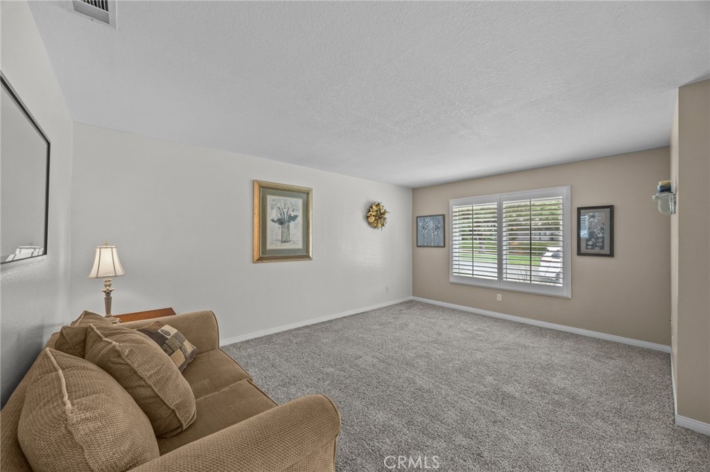 1763 Gleason Street Corona, CA 92882 - Photo 8 of 41 a living room with furniture and a window
