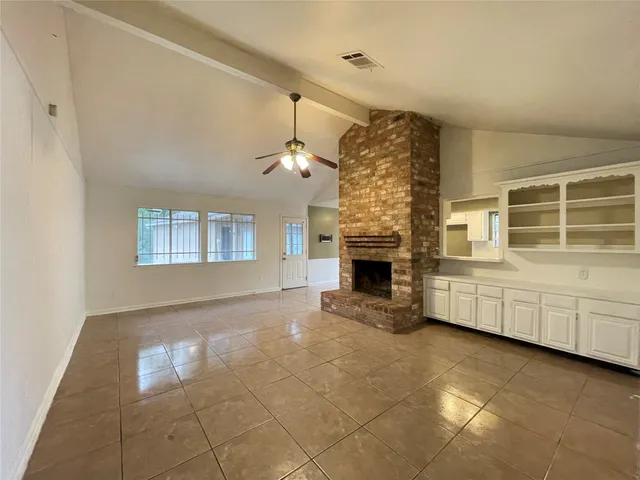a view of empty room with windows