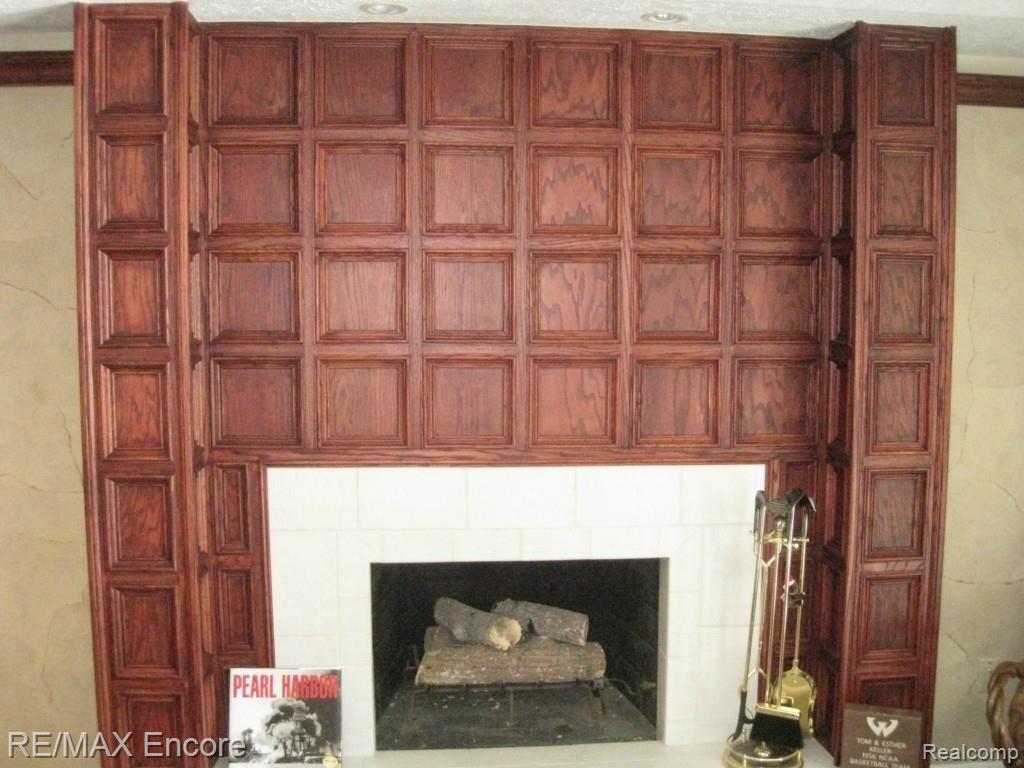 912 GreenView Court Rochester, MI 48307 - Photo 25 of 32 Rec Room Fireplace with Extensive Trim Detail