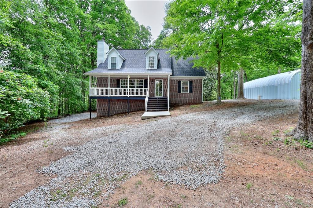 5895 Pattillo Way Lithonia, GA 30058 - Photo 1 of 1 a view of a house with a yard and large tree