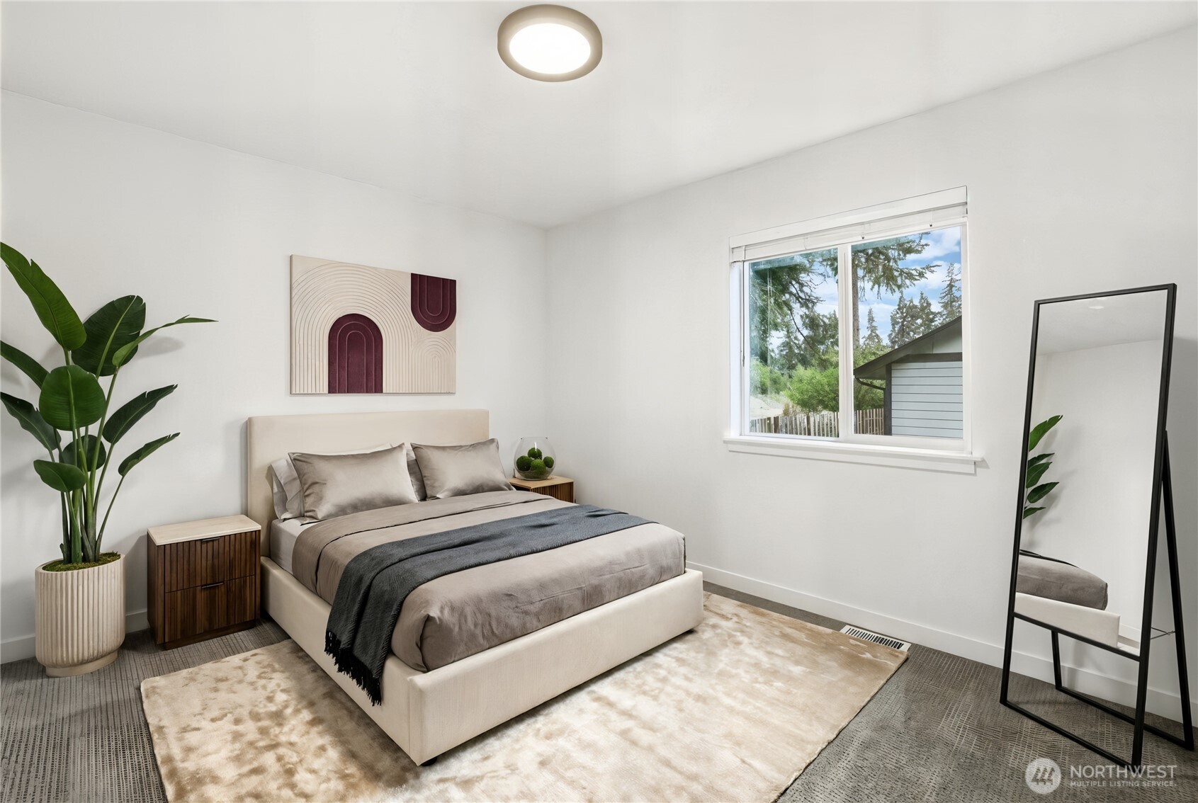 9815 178th Way Southwest Rochester, WA 98579 - Photo 23 of 36 a bedroom with a large bed and a potted plant