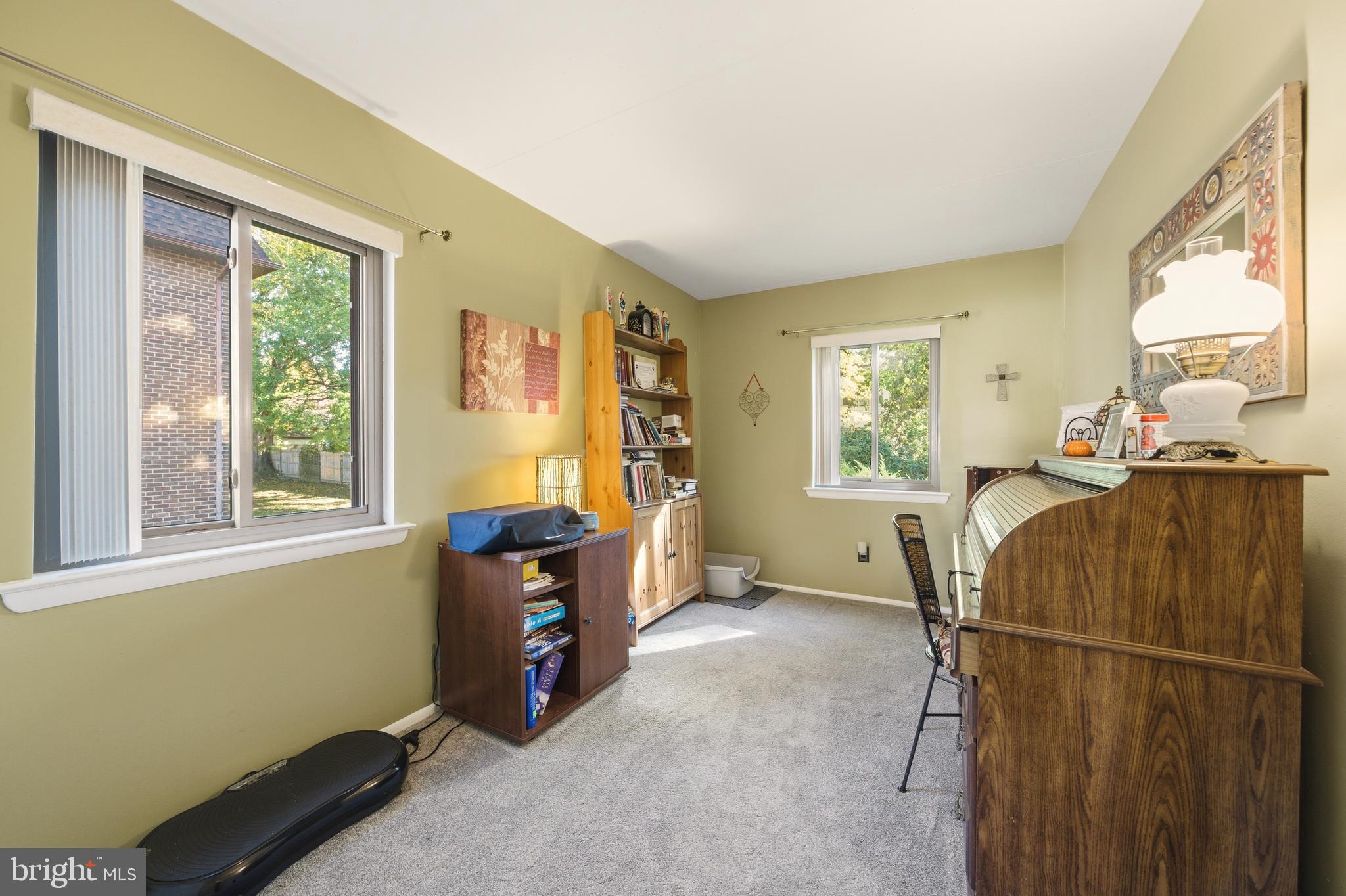 844 Putnam Boulevard, Unit 61A Wallingford, PA 19086 - Photo 17 of 23 a bedroom with furniture and a window