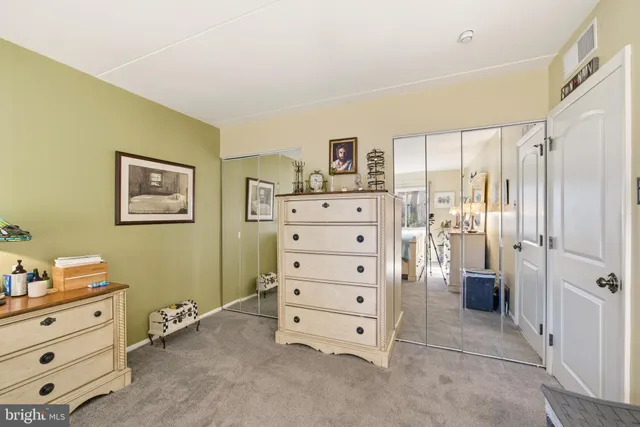 a view of a balcony with table and chairs