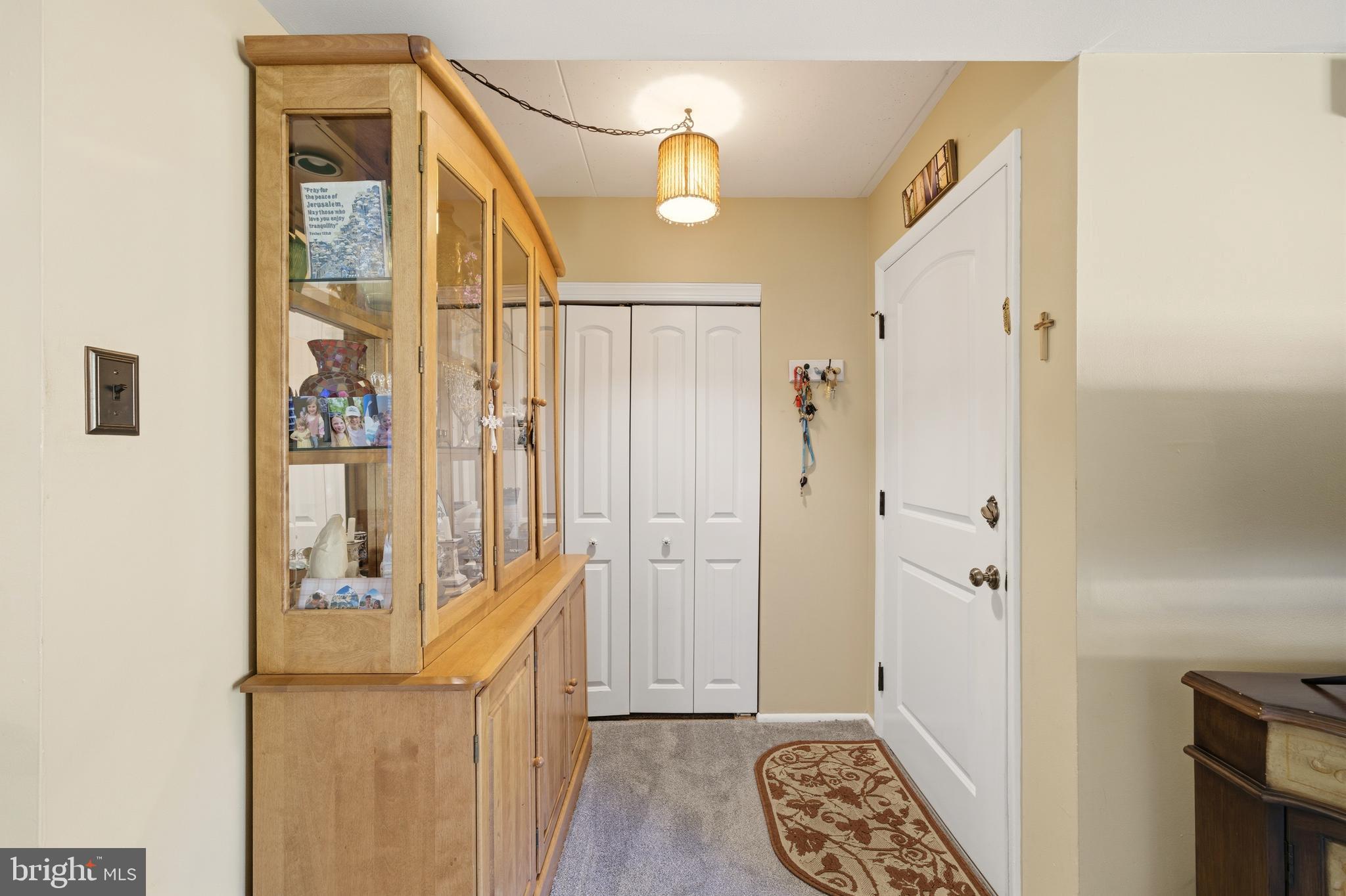 844 Putnam Boulevard, Unit 61A Wallingford, PA 19086 - Photo 4 of 23 a view of a hallway with wooden floor and entryway