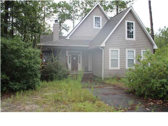 370 Mallet Bayou Road Freeport, FL 32439 - Photo 1 of 12 a view of a house with yard and a garden