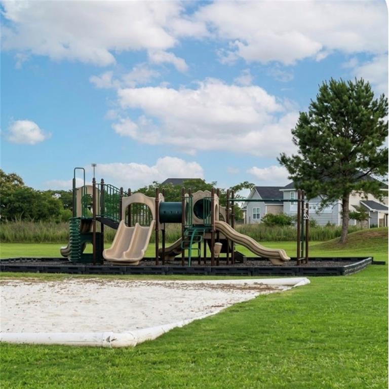 22 Pawnee Trail Fort Mitchell, AL 36856 - Photo 36 of 40 Community playground featuring multiple slides, climbing structures, and protective surfacing